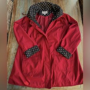 Woman Within Red Trench Coat with Black Polka Dot Lining